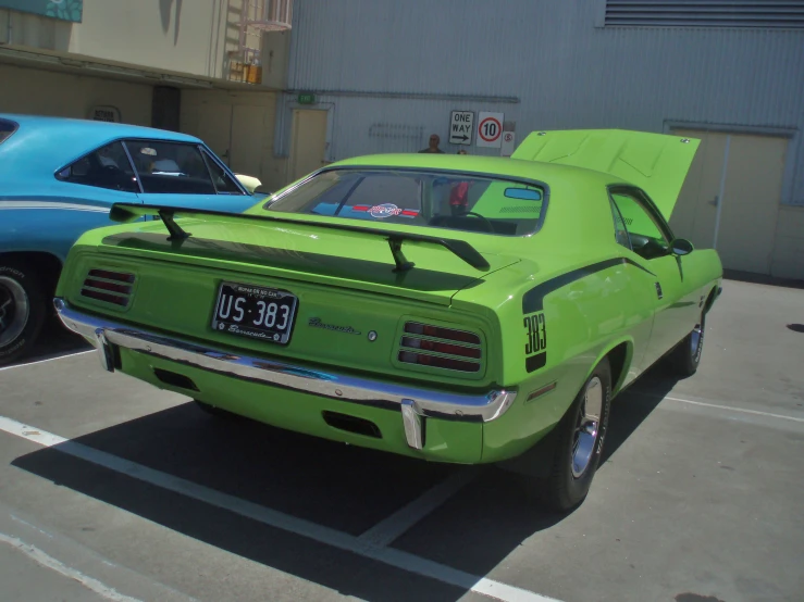 a lime green car parked in a parking space