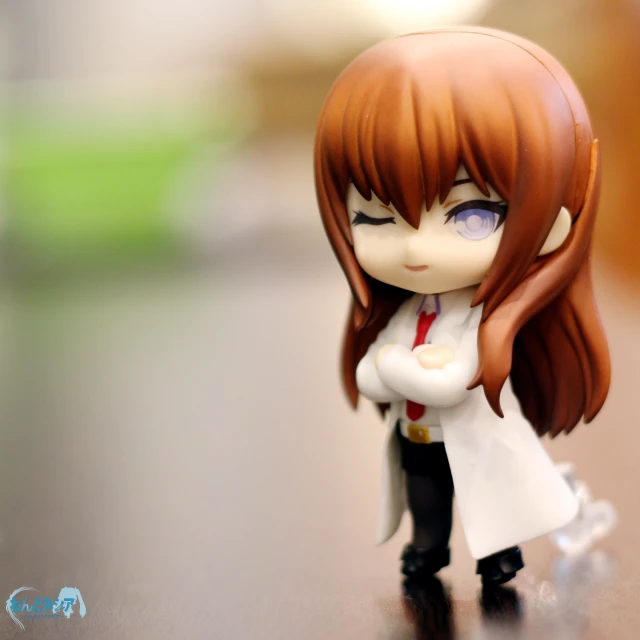 a small, well - made figure of a pretty red haired girl with blue eyes