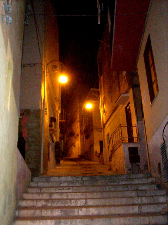 the stairs are dimly lit by street lamps