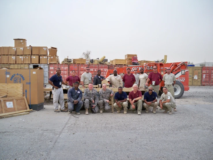 several soldiers pose for a group po together