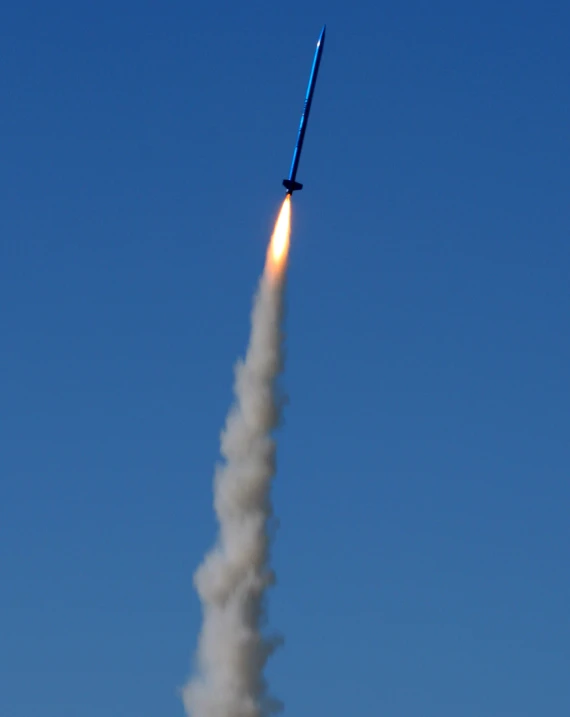 a close up view of a jet launching with smoke