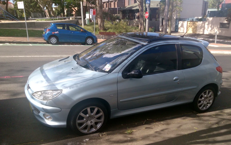 the car is parked on the side of the street