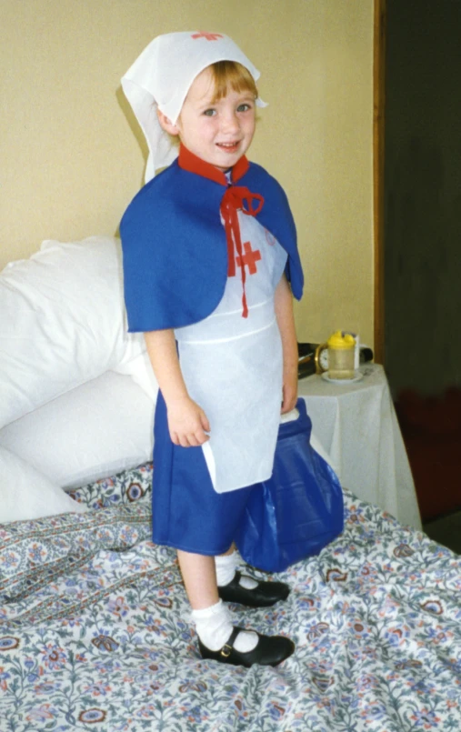 a girl dressed up in costume poses for the camera