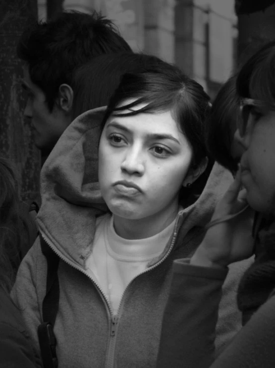 black and white pograph of people with hoodie