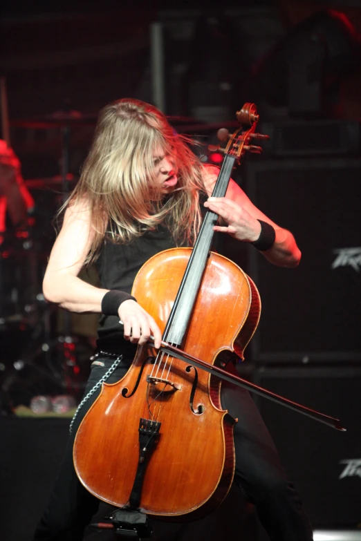 a woman playing the contraption on stage