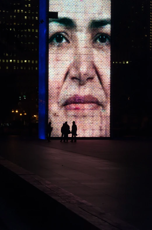 a giant picture on a wall with people sitting