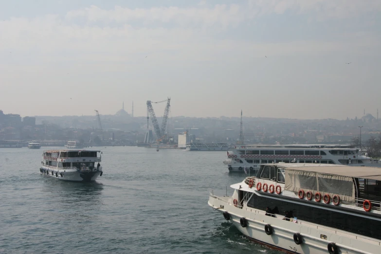 a view from the water that shows the ferries in dock, where boats are anchored and docked