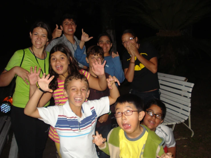 a group of people making the vulcan sign with their hands