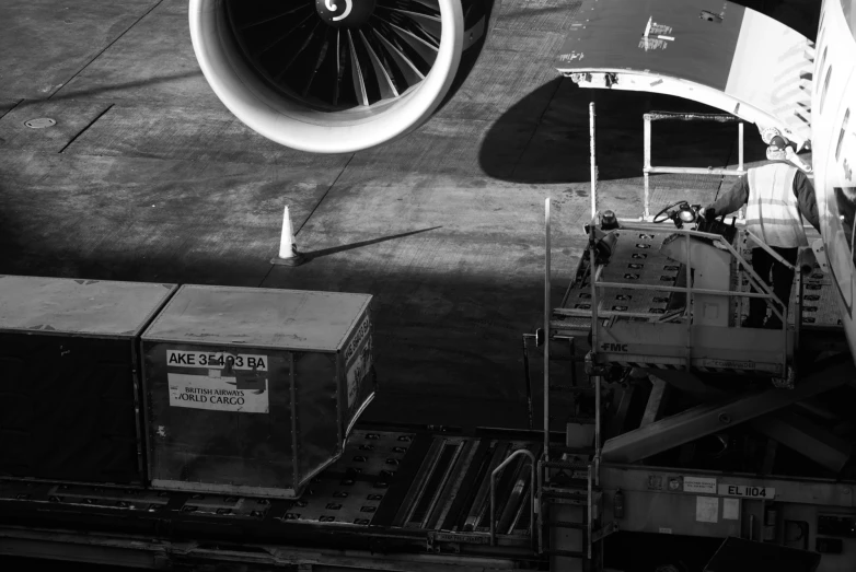 looking at the underside of an airplane's engine, and it's container underneath