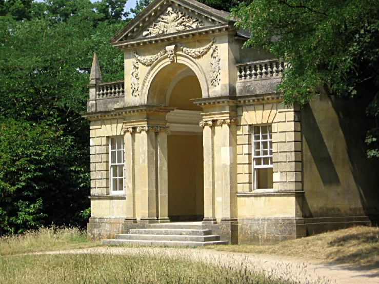 an old building with ornate architecture and trees