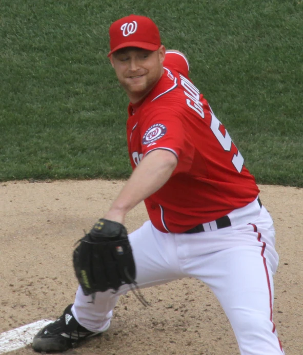 a professional baseball player in the process of pitching