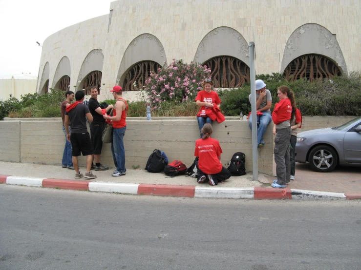 some young men standing on the street corner