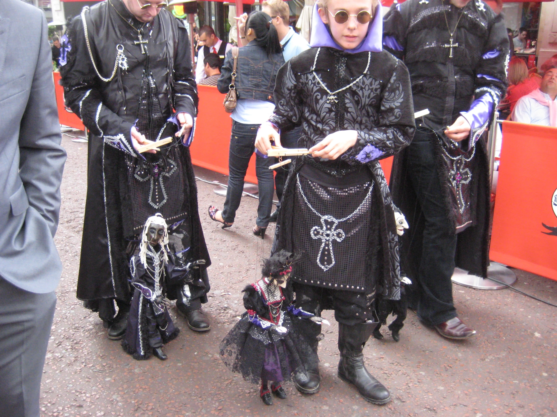 a couple of women dressed in black costumes