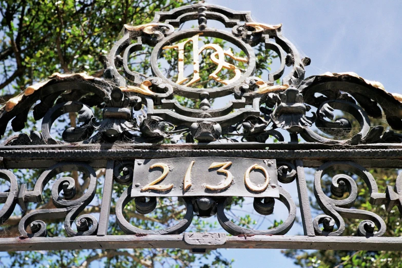 the old iron gate has numbers written on it