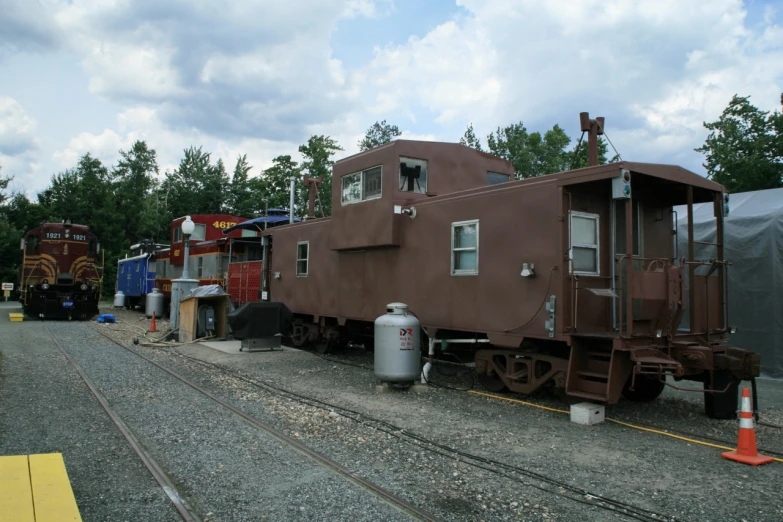 a train on train tracks near an outside cafe