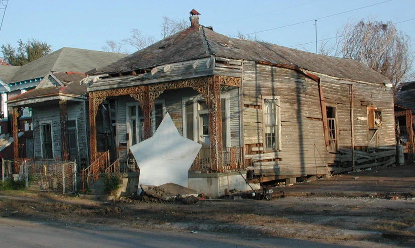 an abandoned home sits in the middle of the day