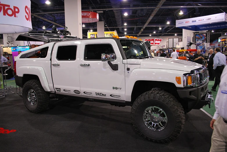 a white truck is parked inside a building