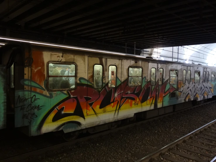 graffiti on an empty train car with its doors open