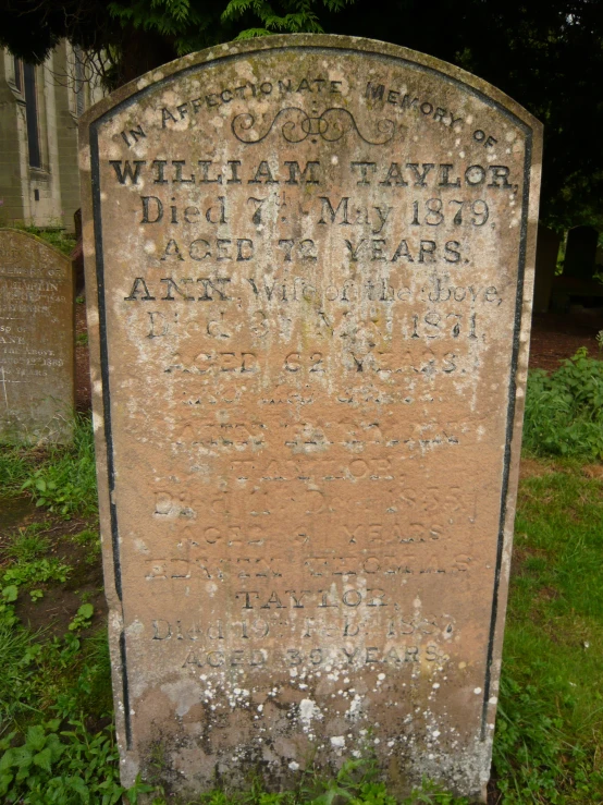 a headstone on a gravestone in a graveyard