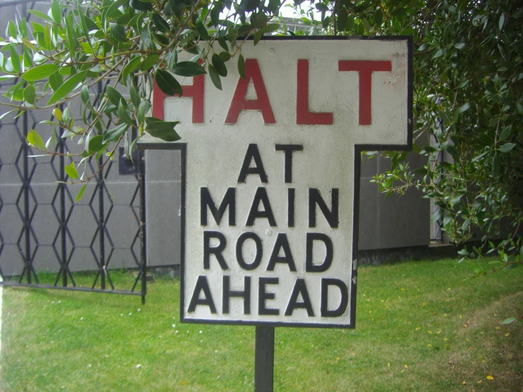 a sign that says fault at main road ahead