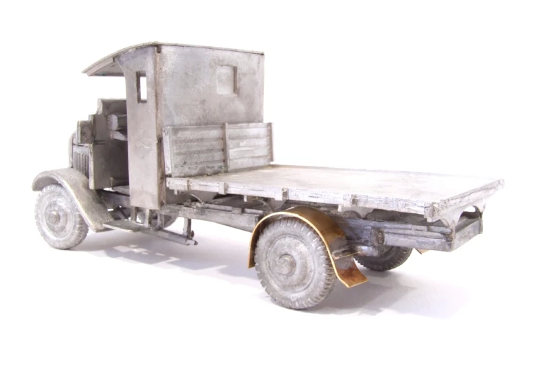 an old truck with a small cart and wheels