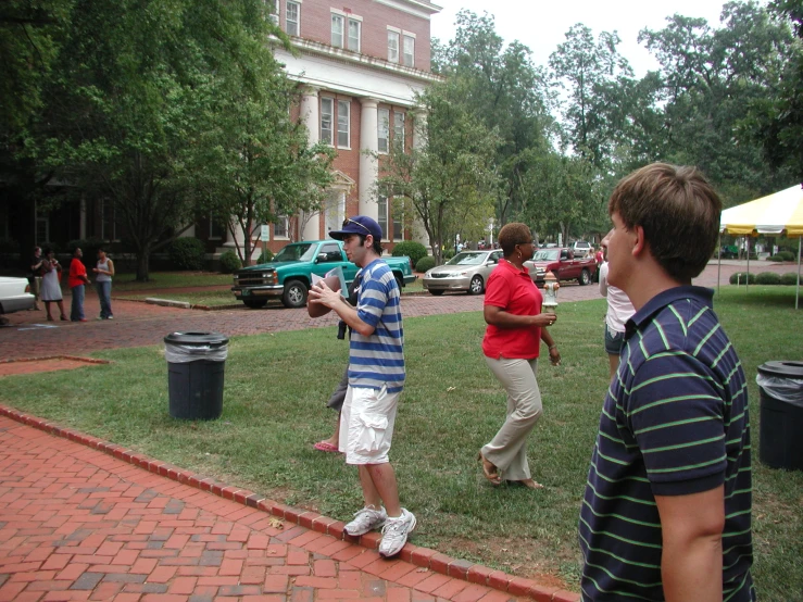 several men playing baseball while on a path