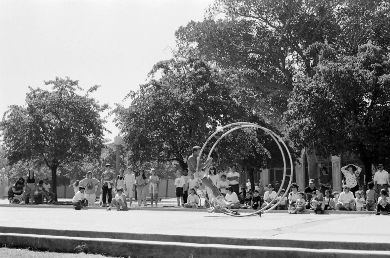 an old pograph of people in the middle of a park