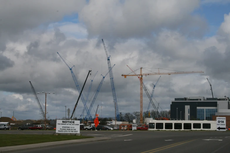 construction site with crane and cranes on cloudy day