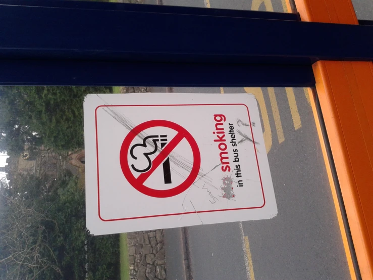 a sign that warns smoking is forbidden
