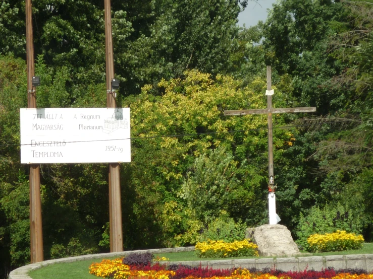 the sign for cemetery with colorful flowers surrounding