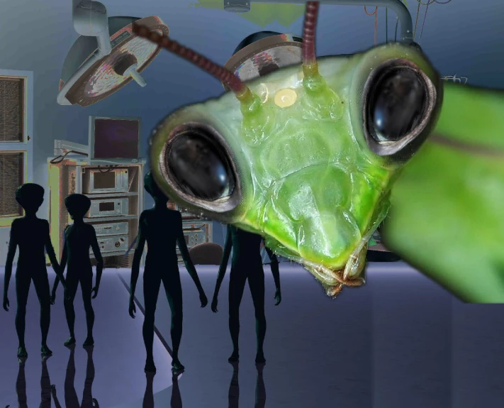 a green alien looking insect in front of a group of people