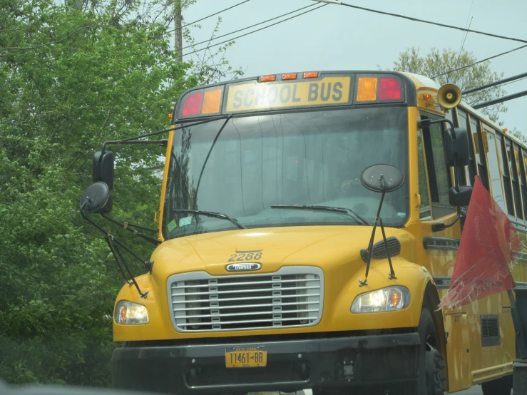 a school bus with its windows open on the road