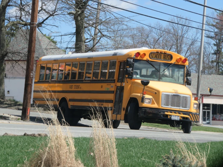 the school bus is parked on the street