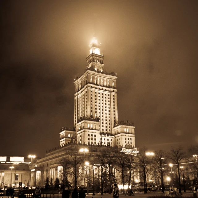 a picture of a building at night in the snow