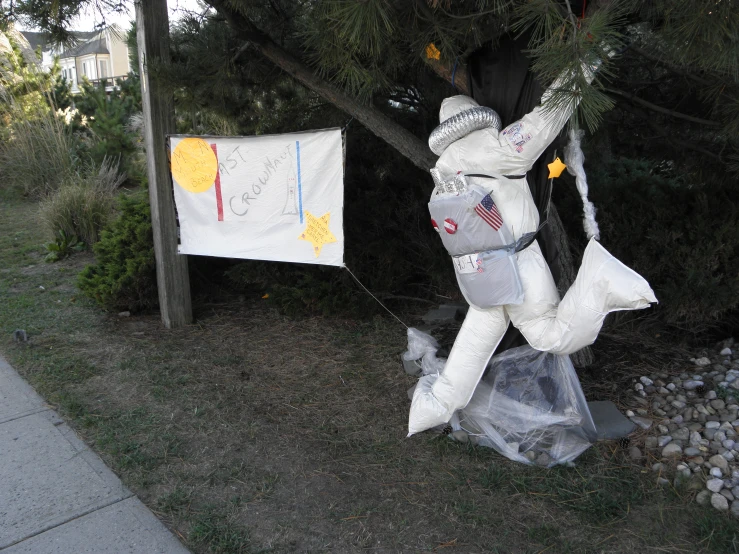 an inflatable man on a swing set