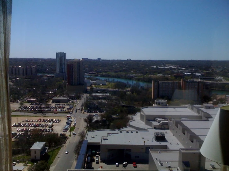 an aerial s of buildings and cars on the ground