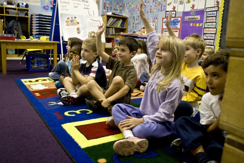 a group of s sitting on the floor