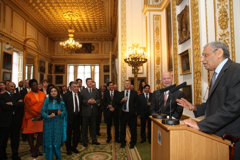 a crowd of people are gathered in a room