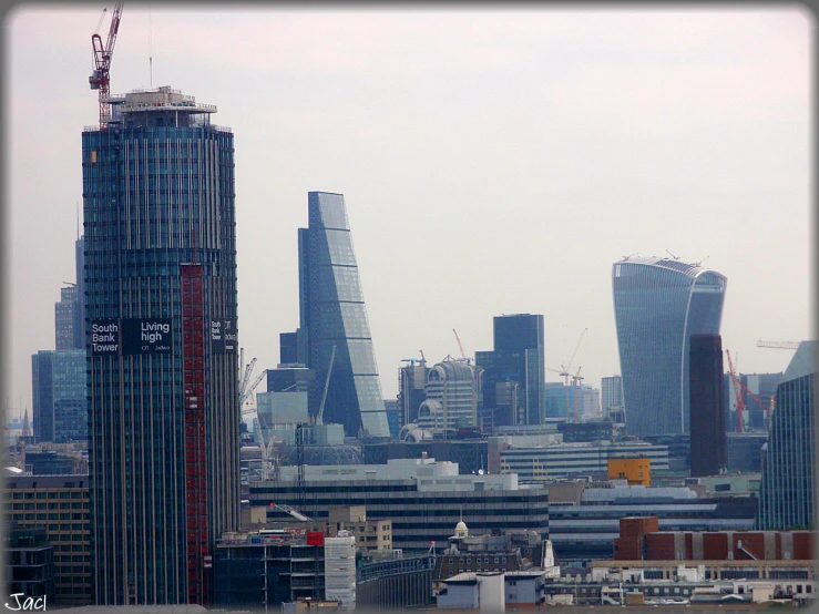 city view of london with some skyscrs against a cloudy sky