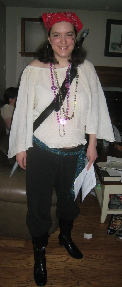 a girl in a pirate costume and some beads