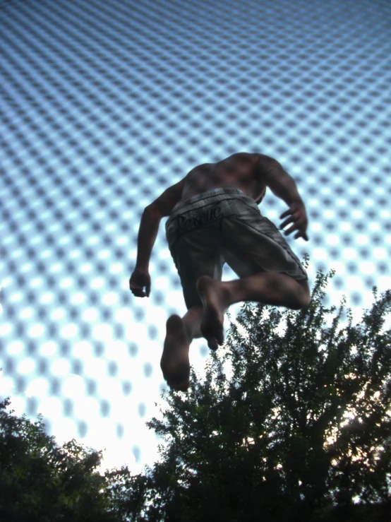 a person jumping off a skateboard onto a ramp