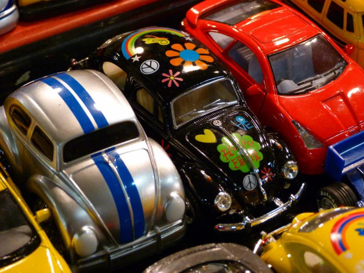 toy cars are displayed on a display in an assortment