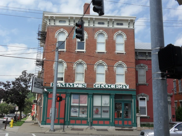 a store front sitting next to the traffic light