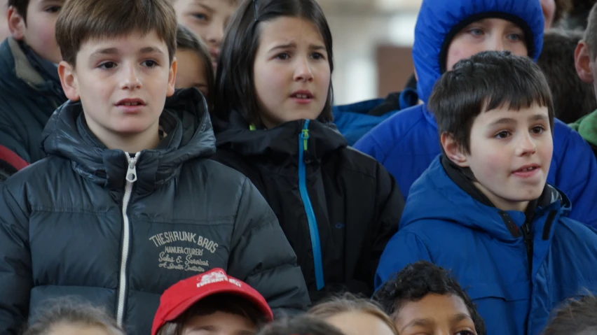 a group of people standing next to each other