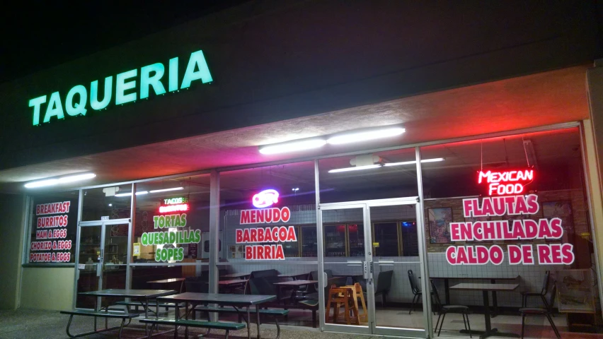 a restaurant at night, it is empty of people