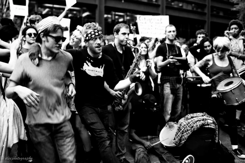 group of people standing outside playing instruments