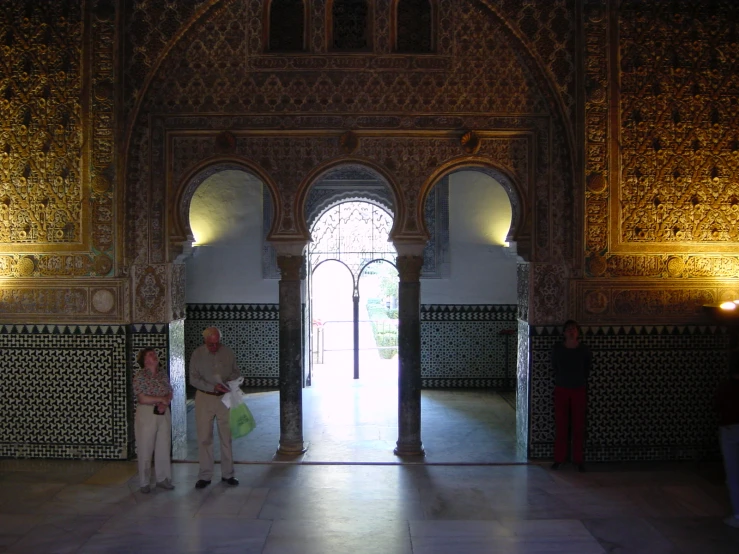 a couple standing in an entryway in a building