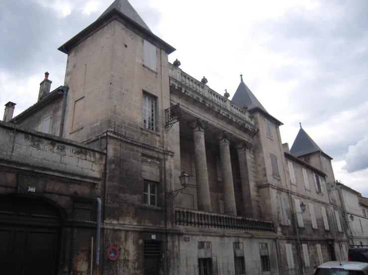 a very old building with towers and two towers next to each other