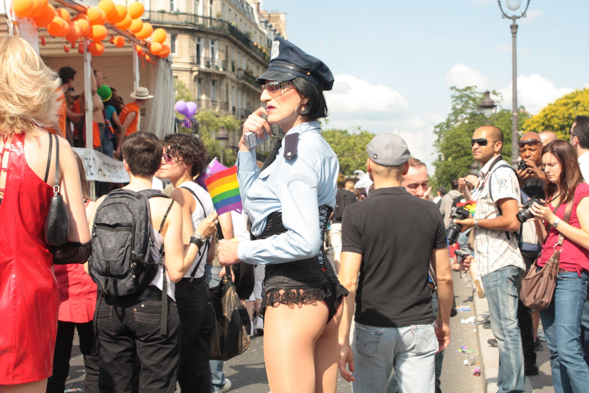 a person dressed as cop standing near people on a street