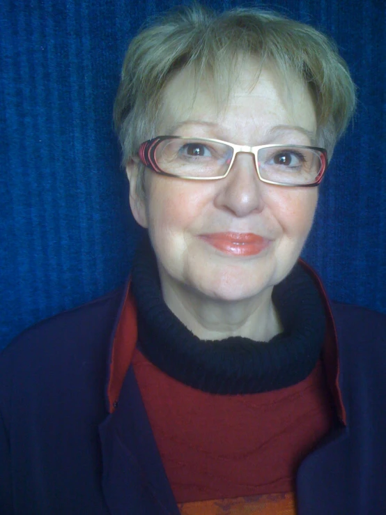 a women with glasses and a red sweater